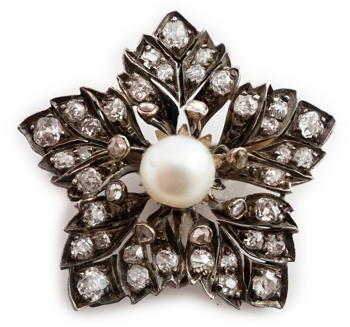 A Victorian gold and silver, pearl and diamond cluster set flower head pendant brooch